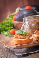 Eggplant caviar in a glass jar with croutons