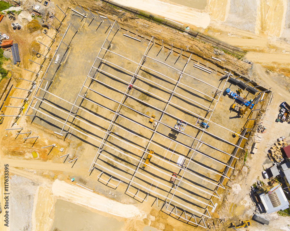 Wall mural Aerial view of construction site. Industrial background from drone. Industry, development and investment in European Union. - Wall murals