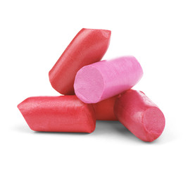 close up of various lipsticks on white background