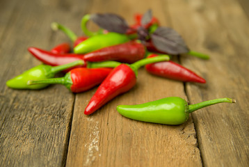 A lot of Chili pepper on old wooden surface