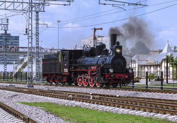 Demonstration of restored vintage locomotives at the celebration of the Day of railway troops of the Russian Federation in Moscow. Steam Locomotive Ov-324