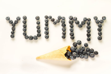 Yummy text made with blueberries