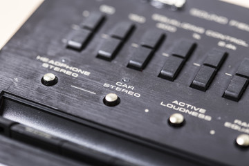 Vintage sound electronics equipment close up stereo buttons
