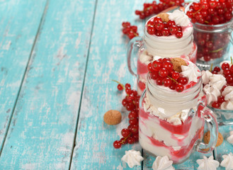Dessert with red currant and whipped cream