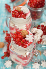 Dessert with red currant and whipped cream