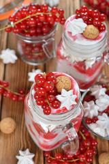 Dessert with red currant and whipped cream
