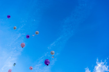 Wedding balloons flying up into the sky