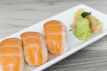 Salmon sushi with wasabi on a dish