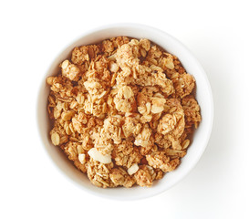 Bowl of whole grain muesli isolated on white, from above