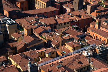 Aerial view of typical historic Italian town with red tiles roofs and narrow streets © Olga K