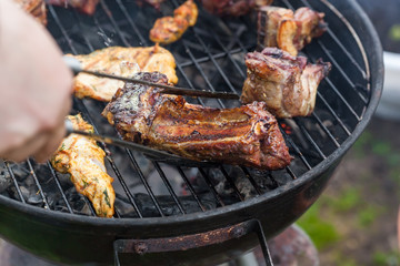 Cooking grilled red meat on barbeque