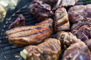 Cooking grilled red meat on barbeque