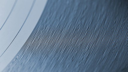 Closeup on grooves of record on turntable