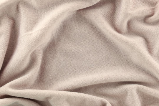Closeup of rippled Cream color cotton fabric.