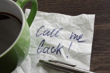 Coffee cup and napkin with message