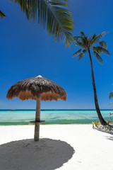 Fototapeta na wymiar Sun umbrella on tropical beach