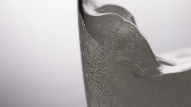 4K Fizzy soda being poured into a glass, in slow motion, with space for text