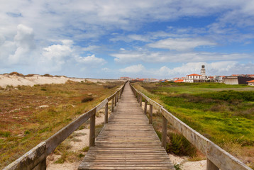 Fototapeta premium Road through sand-dunes on beach of Costa Nova, Portugal.