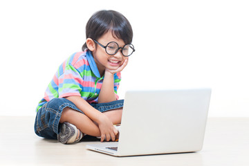 a cute boy using laptop 