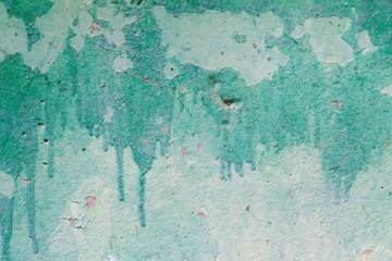 Painted concrete photo texture. Lime wall grunge background. Coating cement surface backdrop with paint streaks.