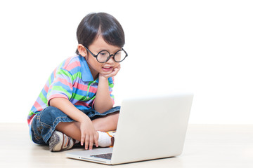 a cute boy using laptop 