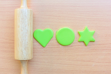 Rolling a green powder for cook a cookie and stamping