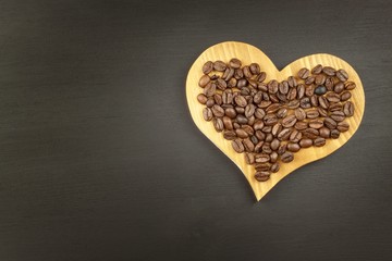 Obraz premium Sales of coffee. Coffee beans on wooden background. 