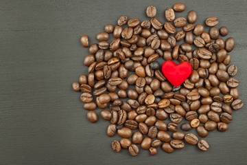 Sales of coffee. Coffee beans on wooden background.
