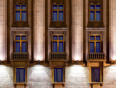 Several windows in a row on night illuminated facade of Hotel Astoria front view, St. Petersburg, Russia.