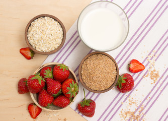 Oatmeal and strawberries on the table