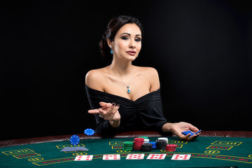 sexy woman with poker cards and chips