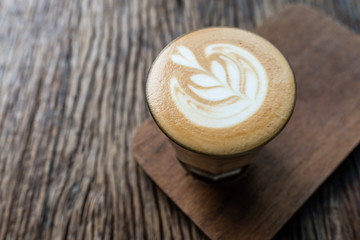 hot latte on a wooden background