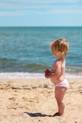 Little baby girl on beach