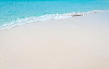 Fototapeta na wymiar Tropical beach with coral white sand and calm wave