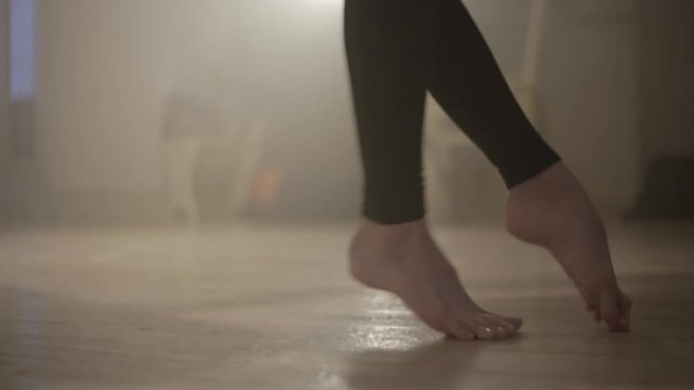 Girl dancing. Close-up of legs