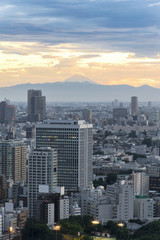 Fototapeta na wymiar sunset Cityscape of Tokyo City and fuji mountain view from skyli