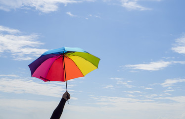 Colorful umbrella under blue sky 1