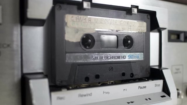 audio cassettes in a retro tape player