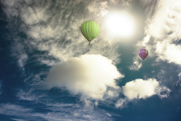 Fototapeta na wymiar Colorful hot air balloon high in the sky