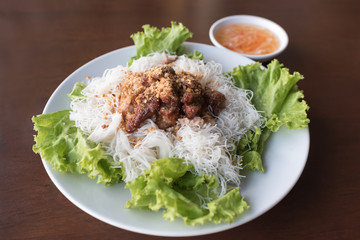 Vietnamese grilled pork served with vermicelli and lettuce