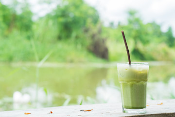 Ice Macha Green Tea on wooden desk