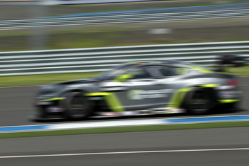 car racing on the road and track with motion blur and Radial blu