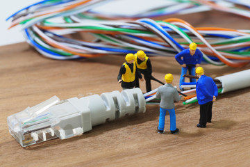 Group of engineer workers are repair LAN network connection Ethe - obrazy, fototapety, plakaty