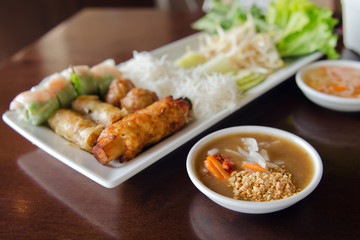 Spring roll with pork, fried shrimp with sugar cane and vegetabl