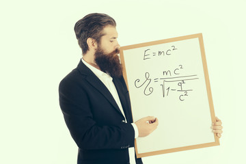 bearded man with einstein formula and newtons law