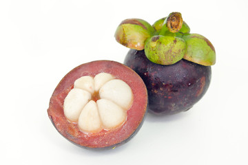 Mangosteen fruit with half cross section isolated on white