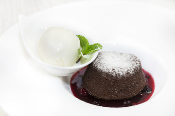 piece of cream cake decorated with chocolate and mint