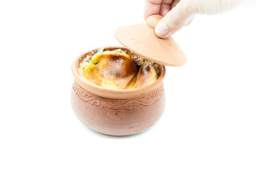 Thai dessert in clay pots in woman hand,Mung Bean Thai Custard Dessert on white background,thai food style