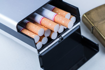 Smoking set. Pocket lighter, cigarette and pack of cigarettes