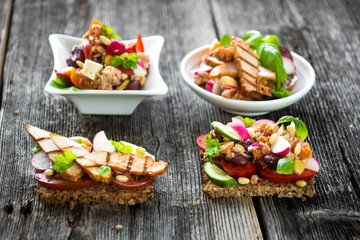 Delicious tapas on a wooden background